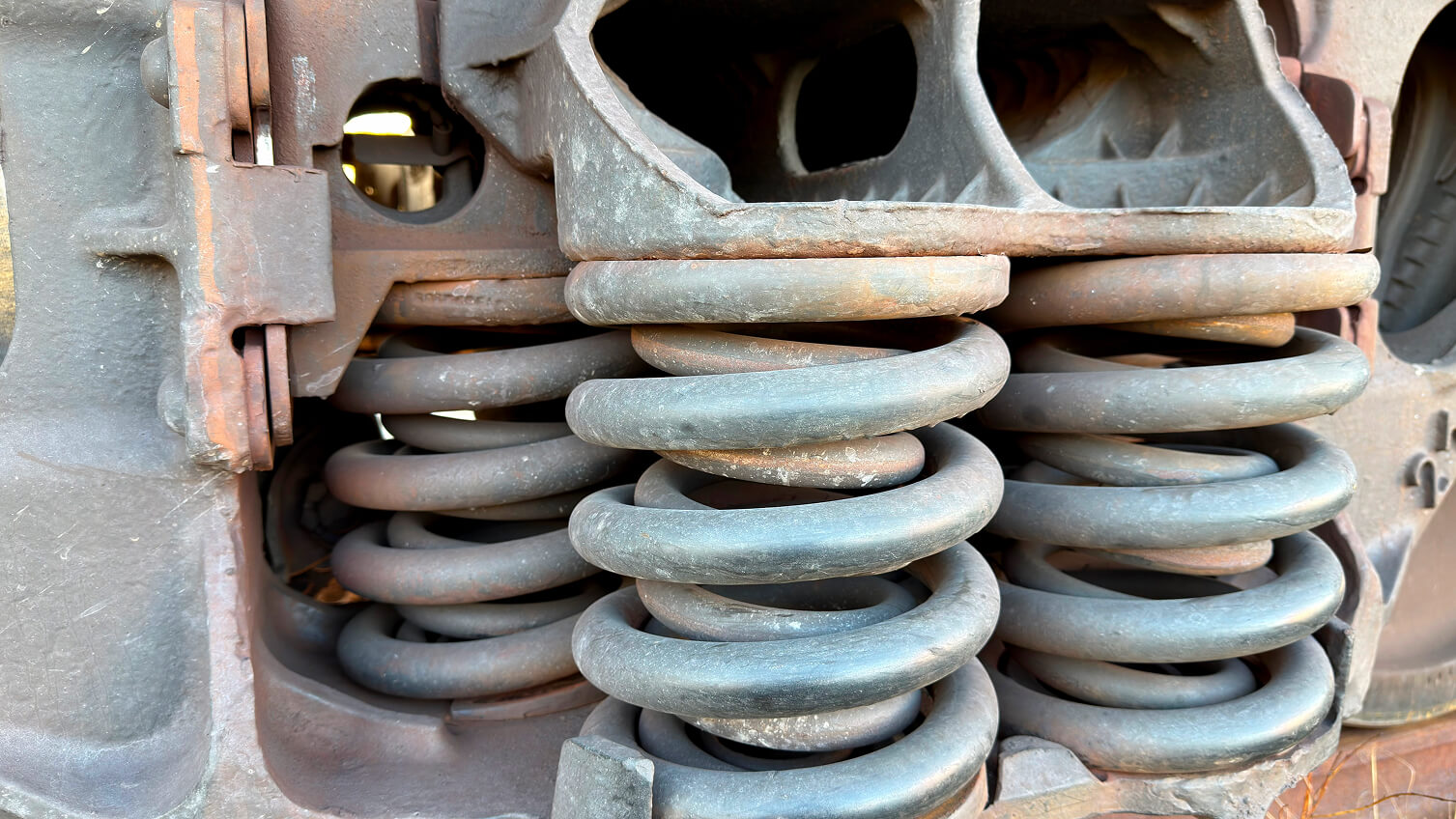Compression springs inside of a piece of manufacturing equipment.